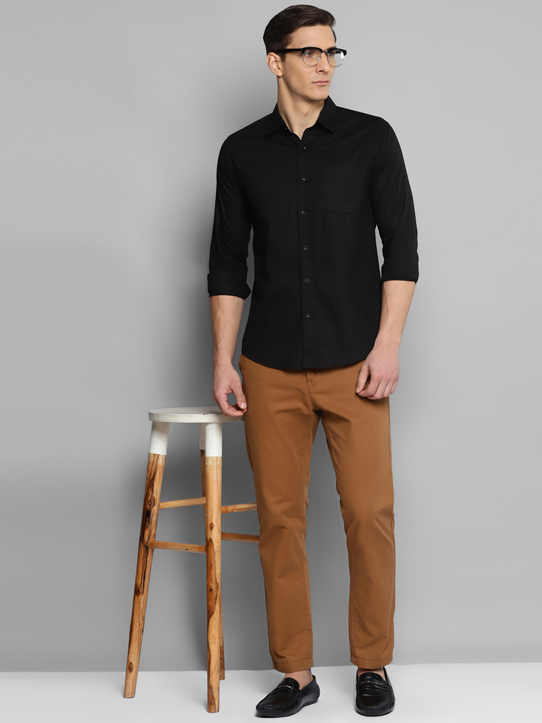 Black shirt dark brown pants on sale